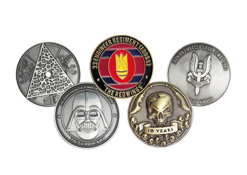 A selection of five custom coins made to commemorate military units, EDC groups and pop-culture genres.